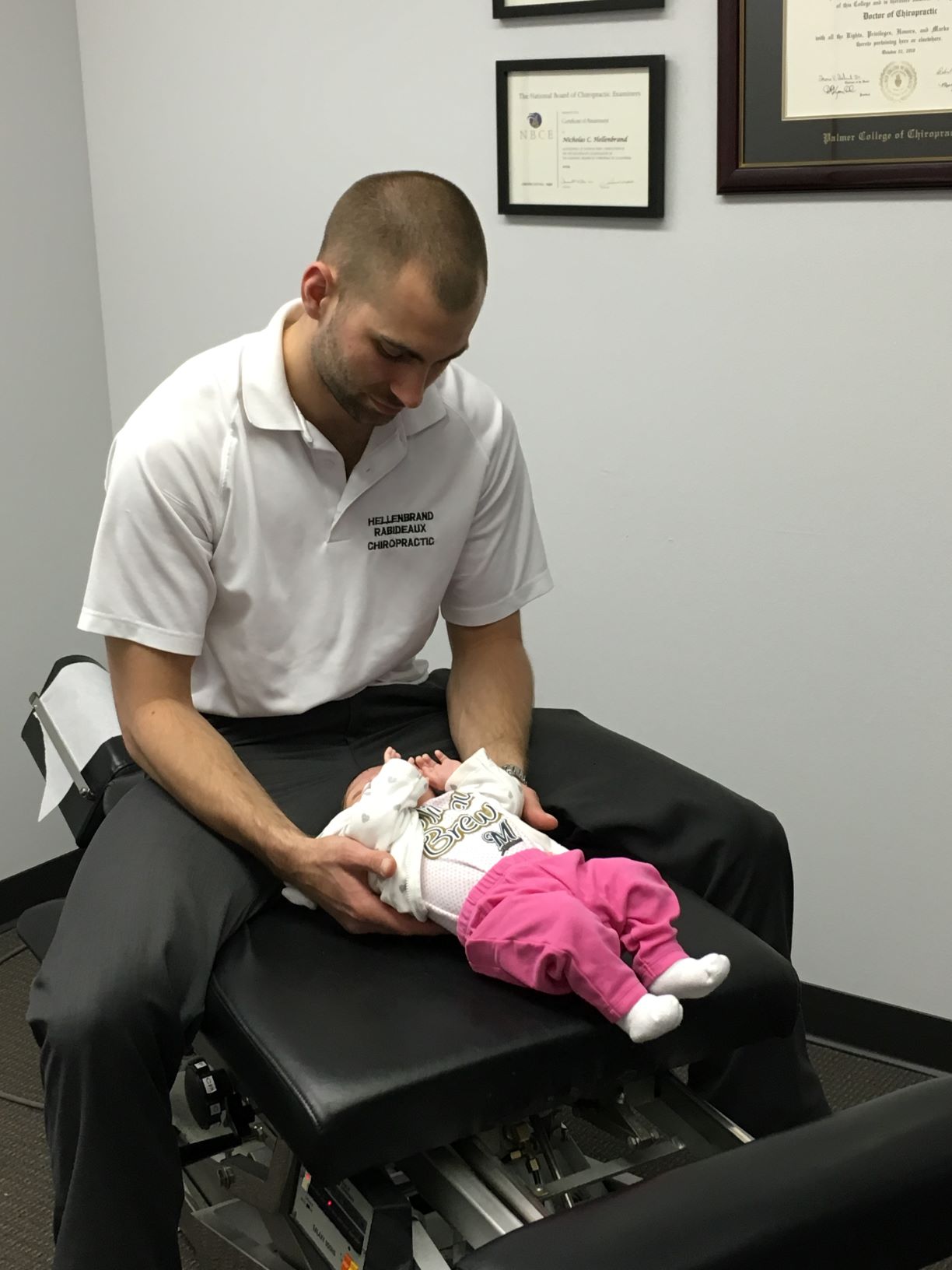 Dr Nick adjusting infant